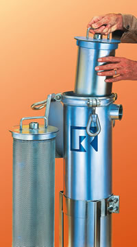 An SP-style basket being put into a Rosedale Model 8-30 vessel. An RS-style basket is in the foreground.